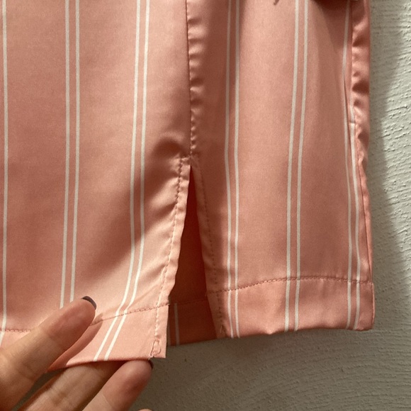 Pink silky mini skirt.   Forever 21 - Picture 4 of 5